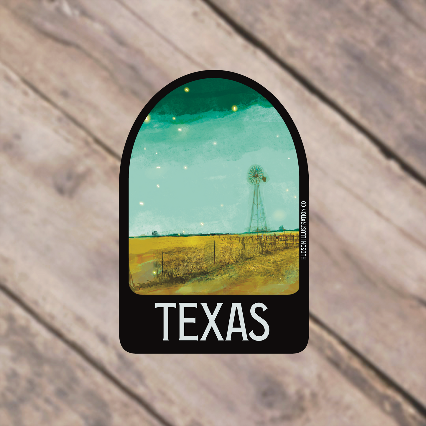 a sticker with a picture of a windmill in the distance