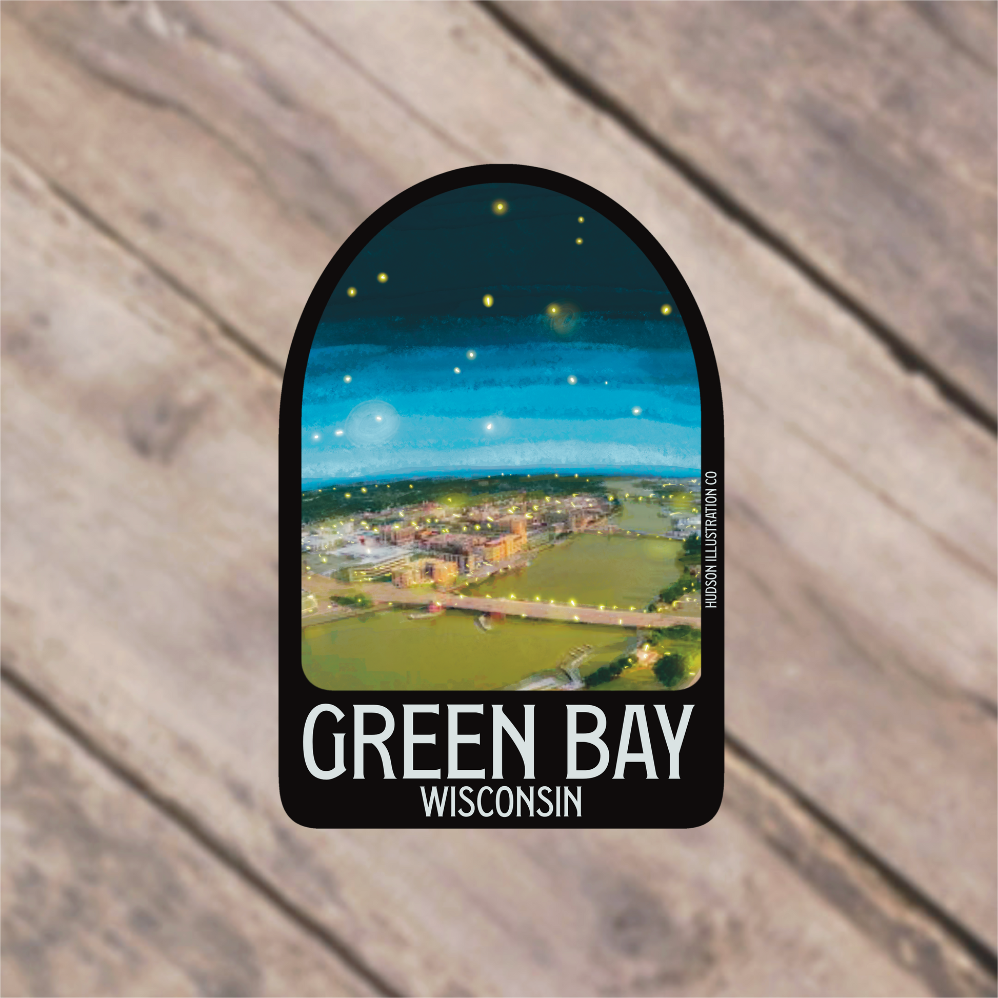 a green bay wisconsin sticker on a wooden background