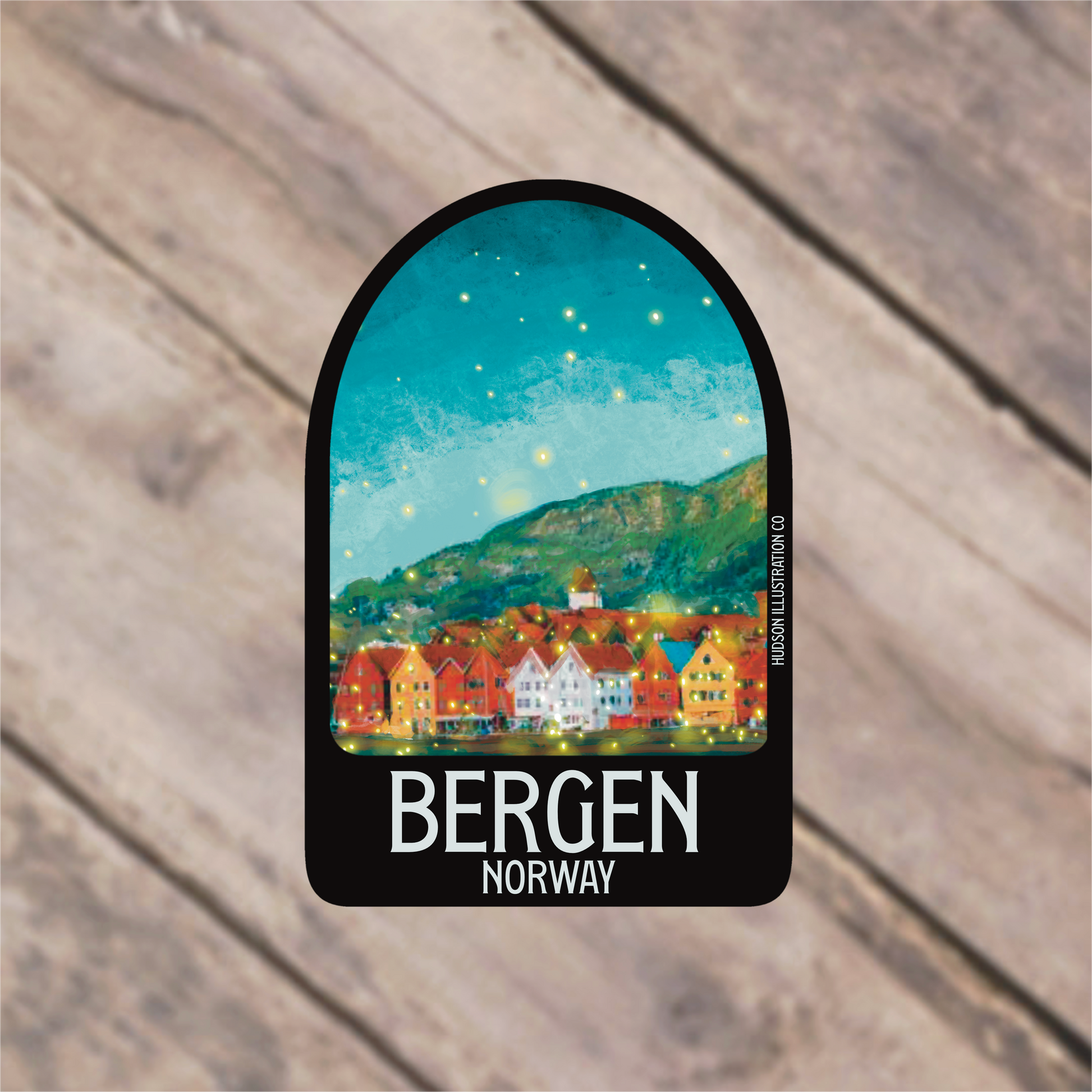 a sticker with a picture of a town on it