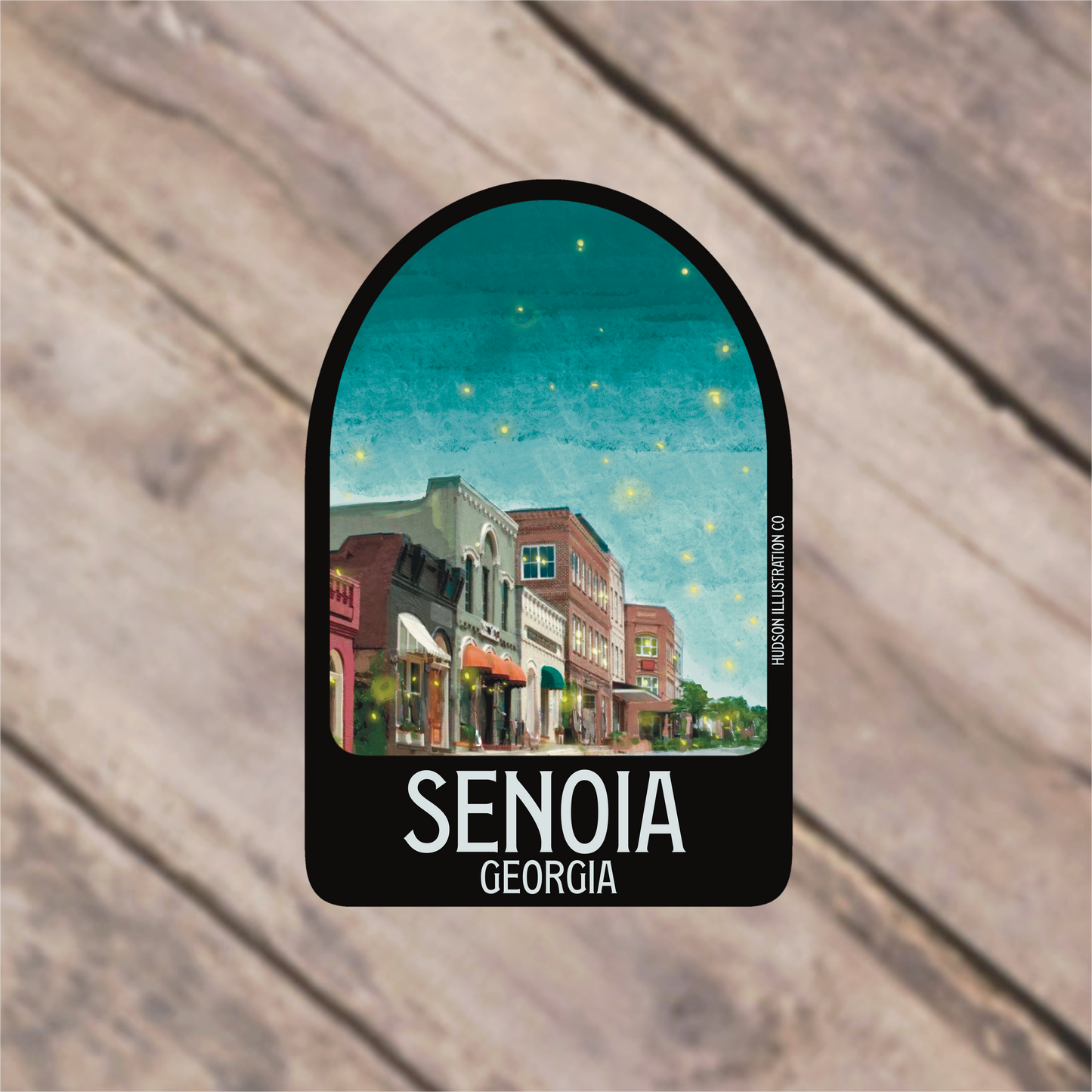 a sticker with a picture of a town on it