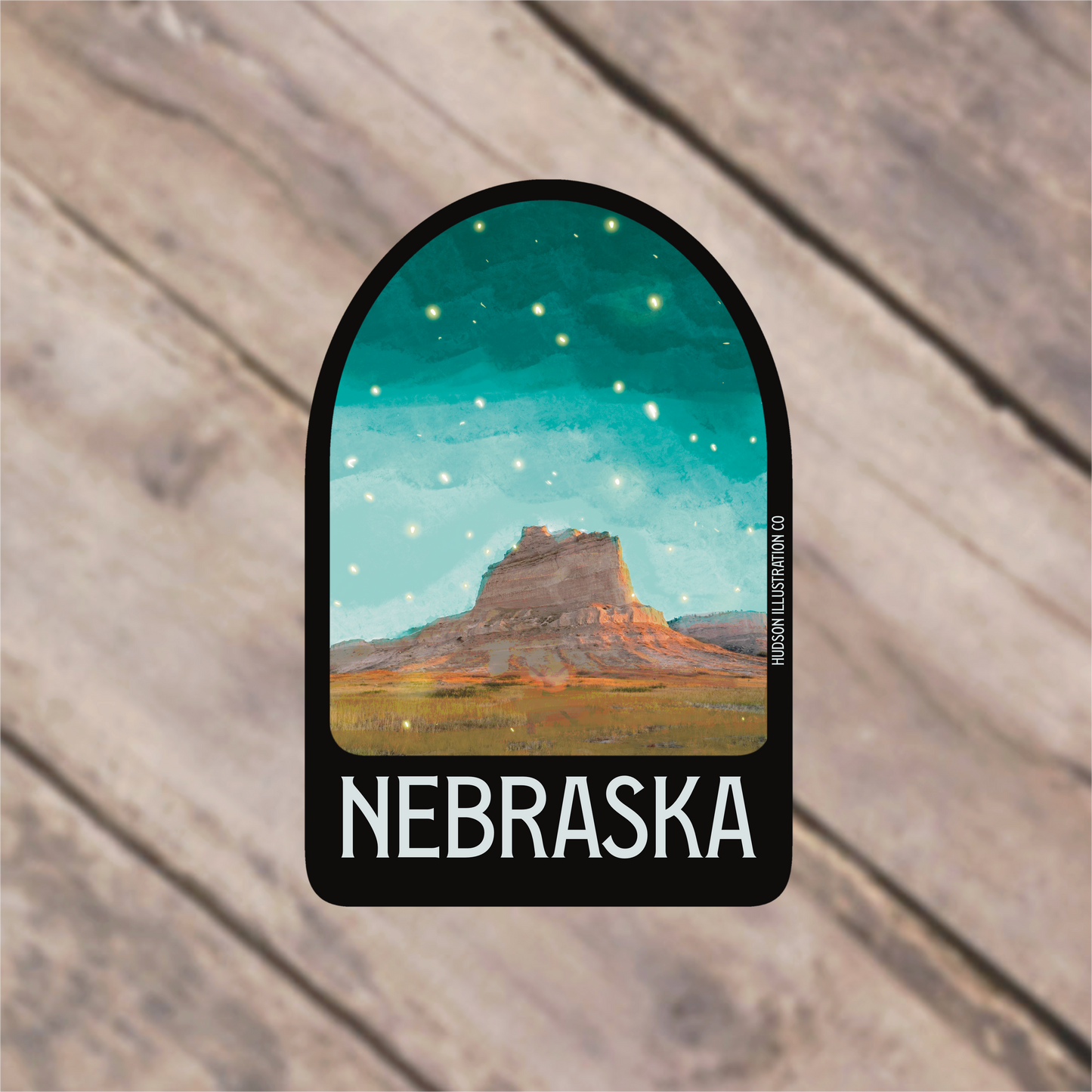 a sticker with a picture of a mountain in the background