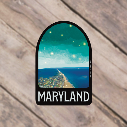 a sticker with a picture of a road leading to the ocean