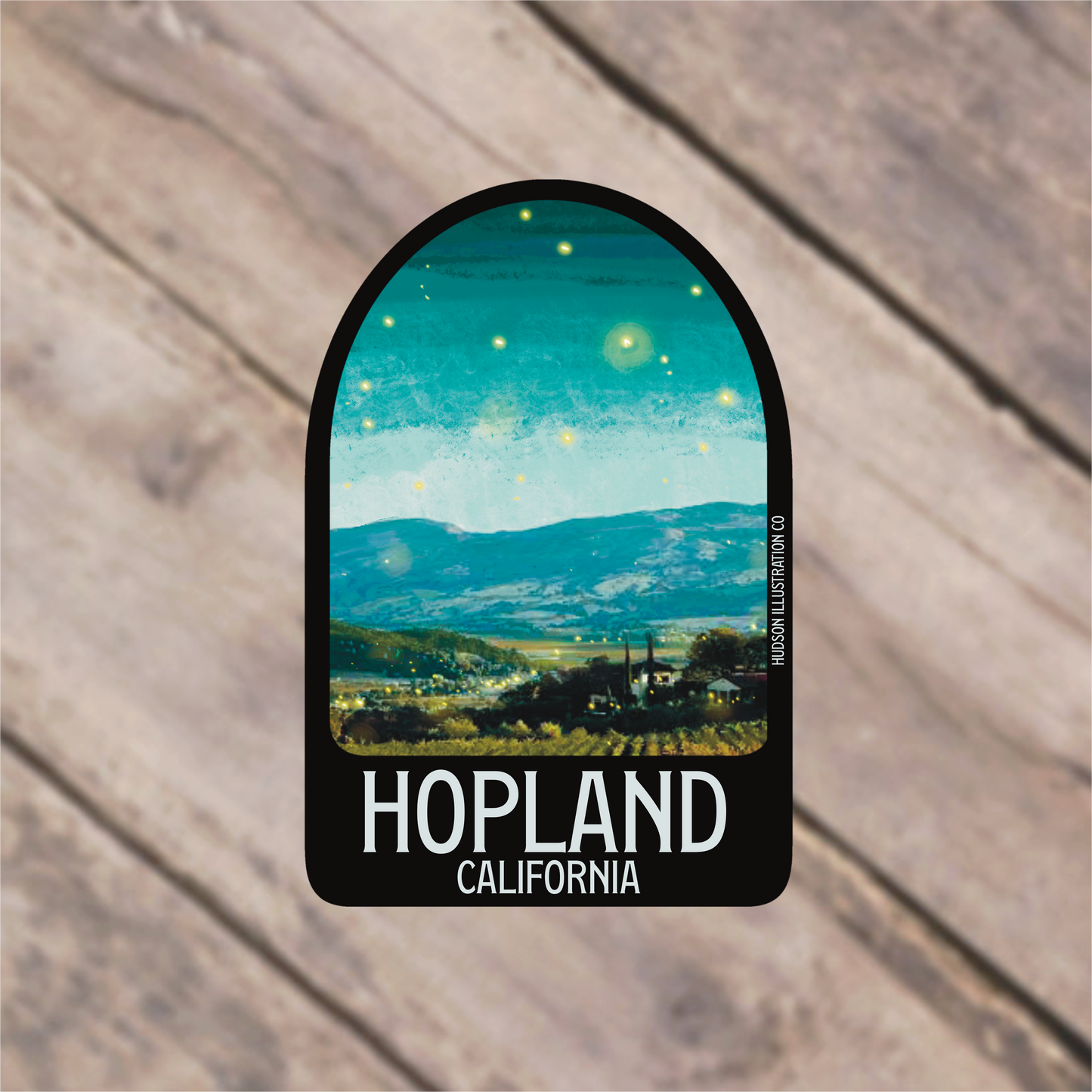 a sticker that says, hopland california on a wooden background