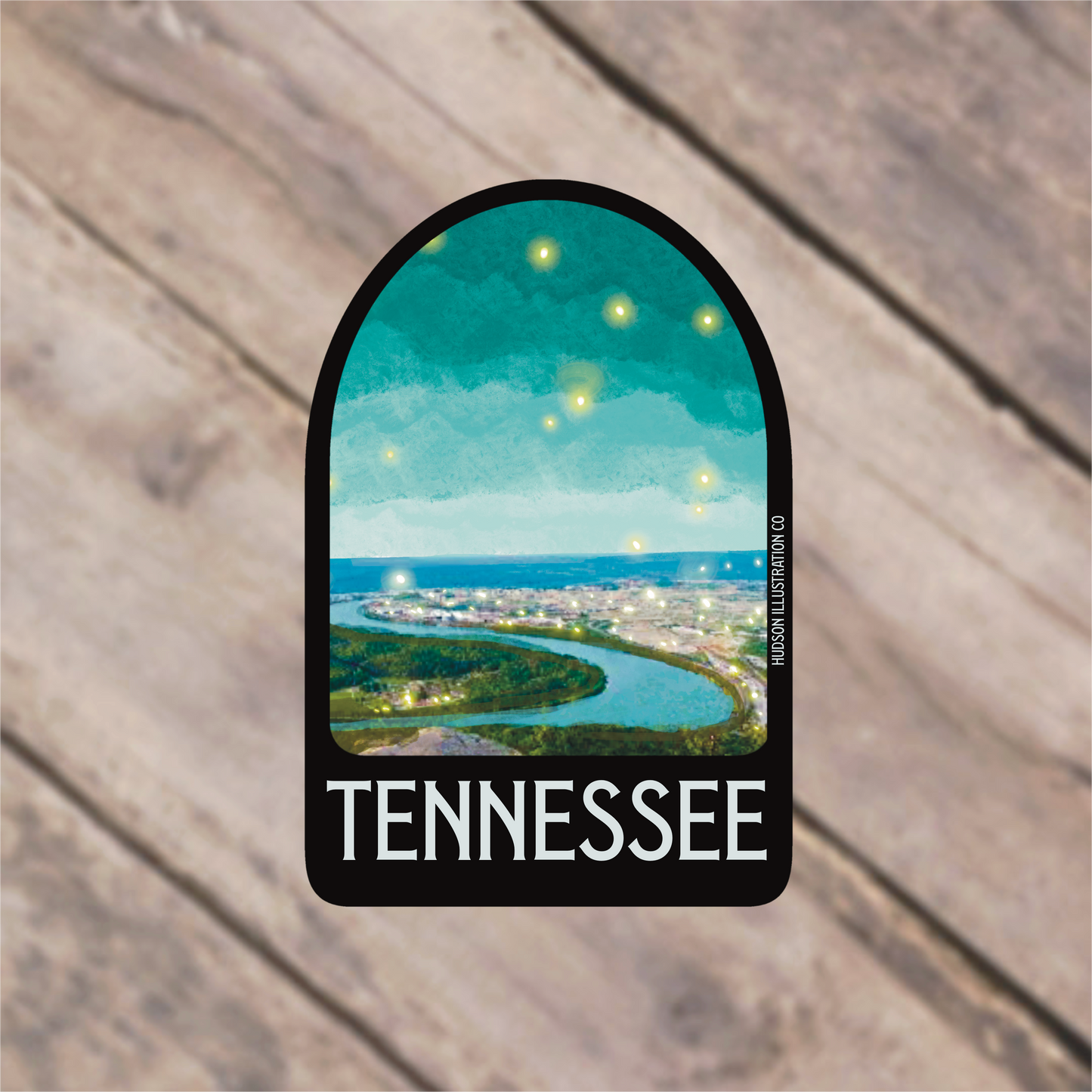 a sticker with a picture of a city and a river