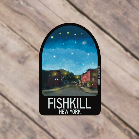 a fishkill new york sticker on a wooden surface