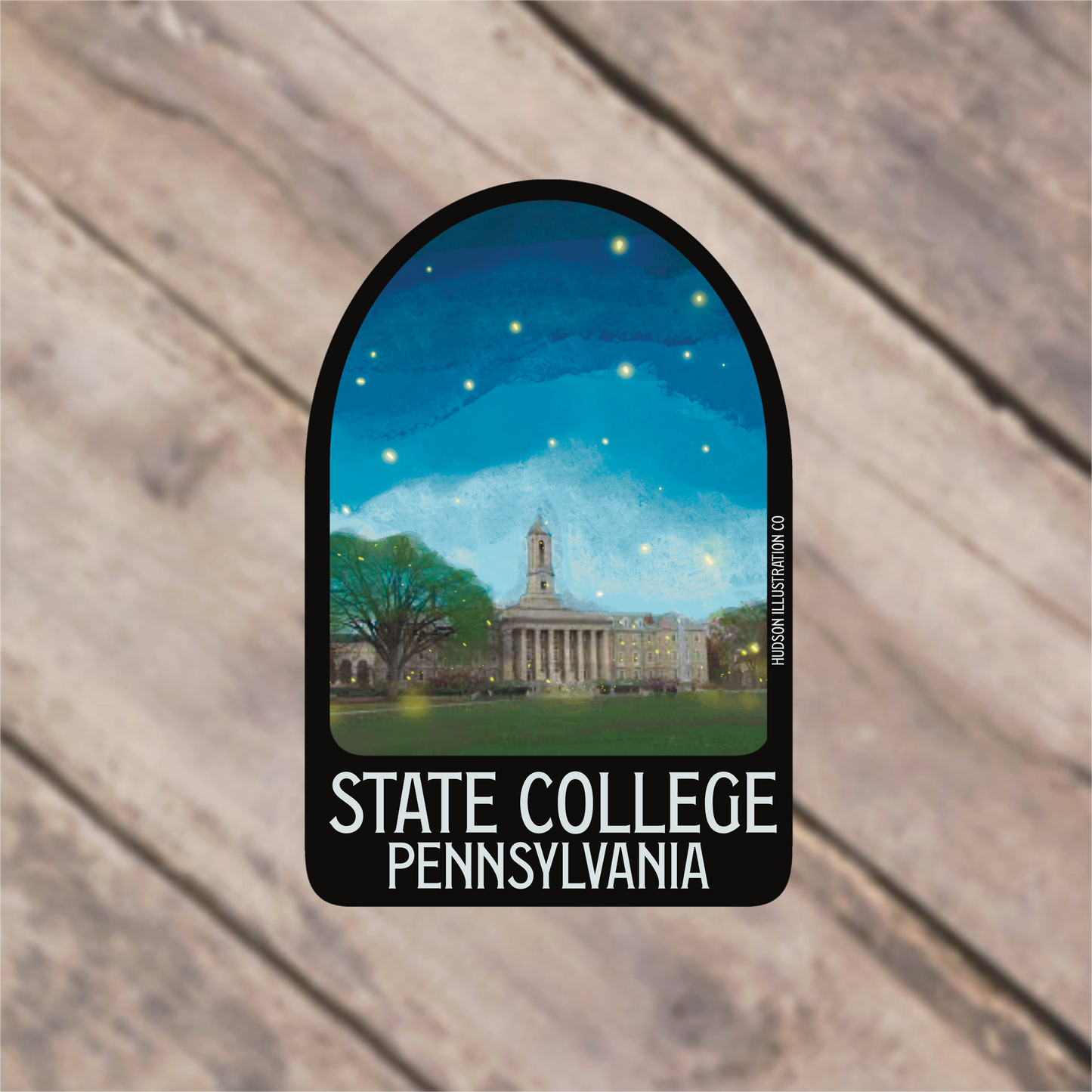 a sticker of a state college with a building in the background