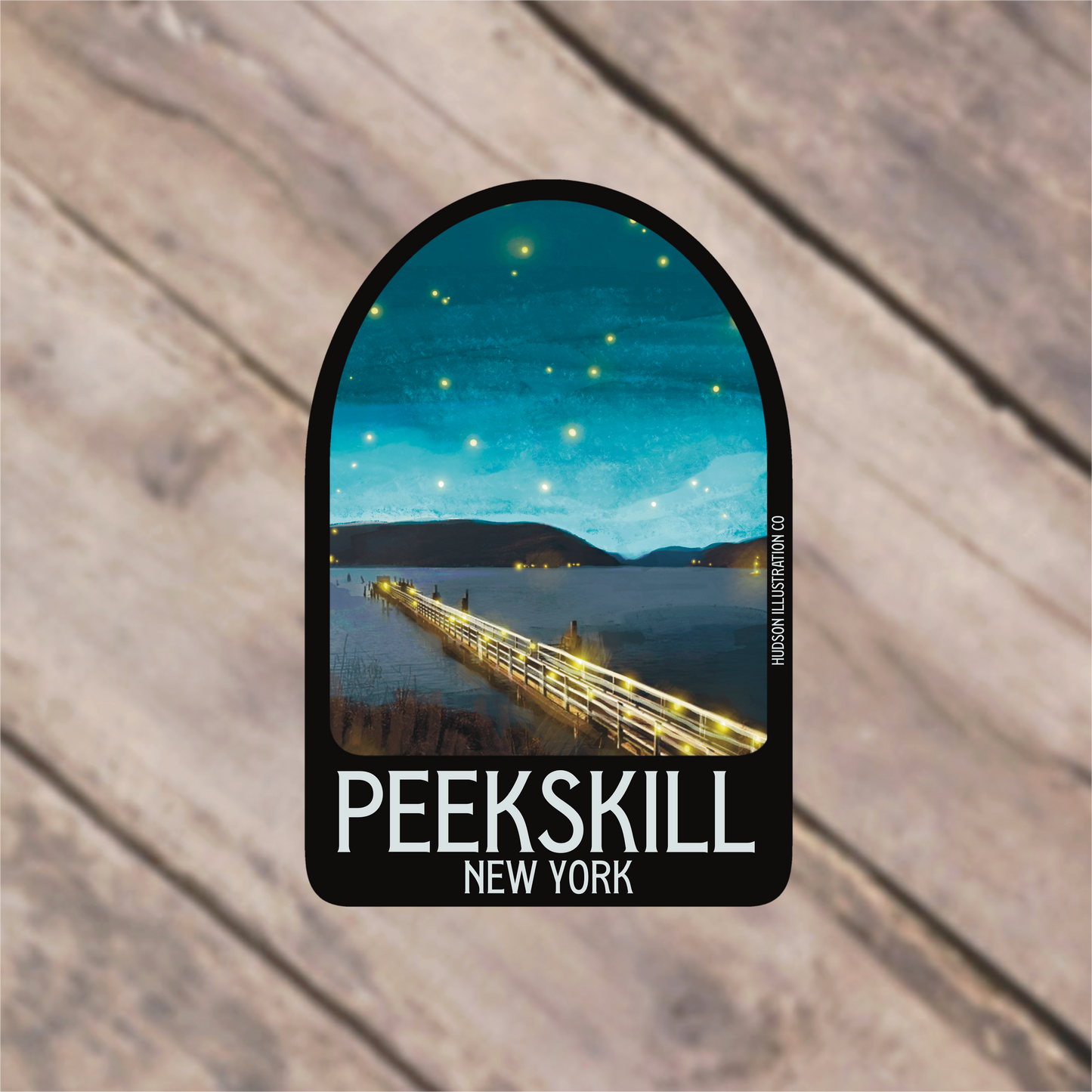 a sticker with a picture of a pier in the background