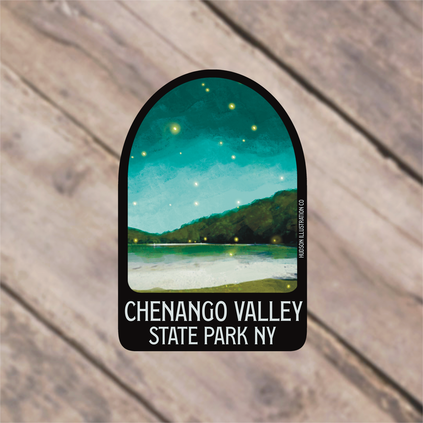 a sticker with a picture of a lake and mountains