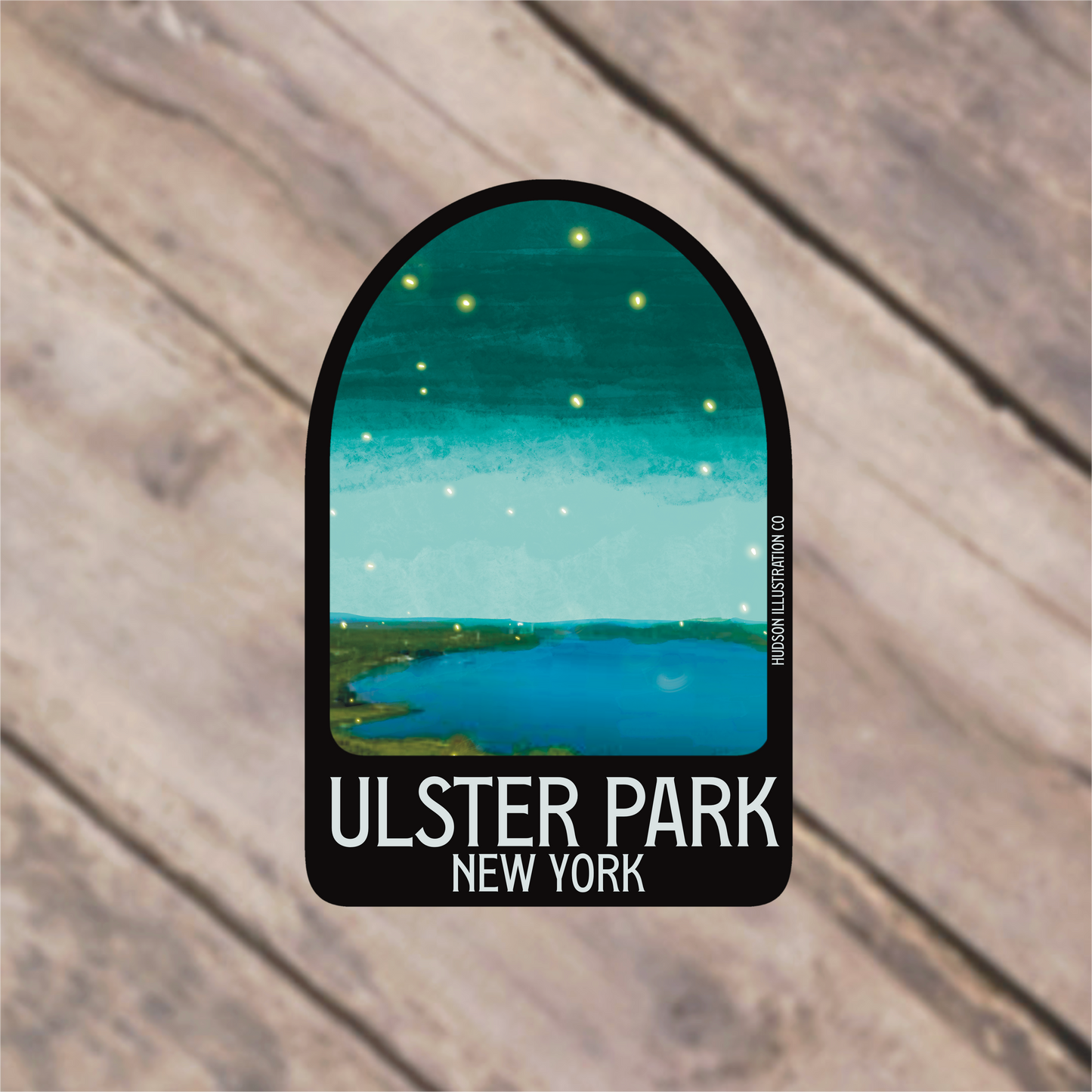 a sticker with a picture of a lake and stars in the sky