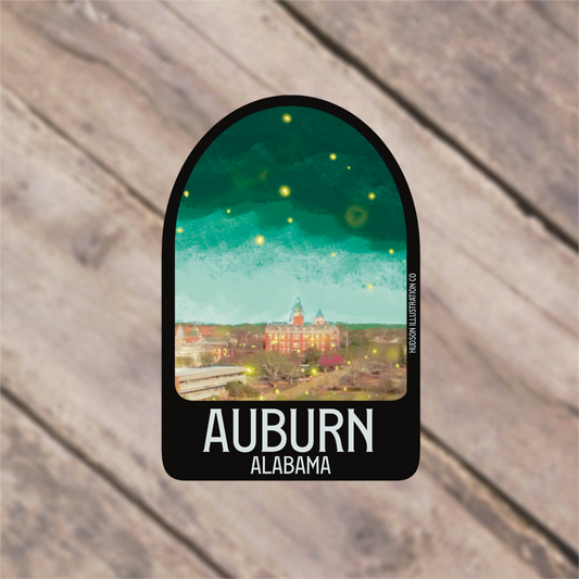 a sticker with a picture of a town in the background